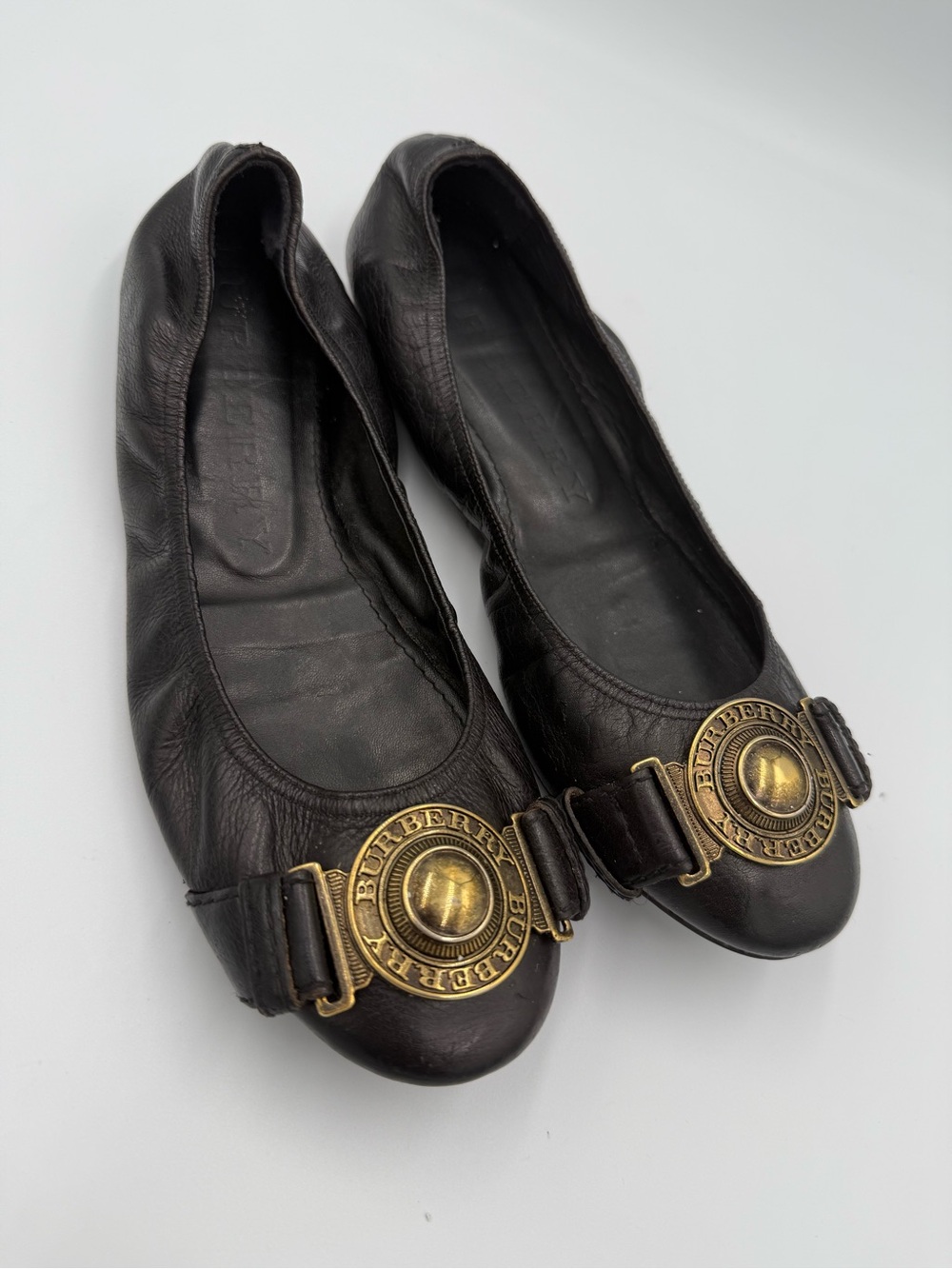 Burberry Black Leather Ballet Flats with Signature Brass Emblem